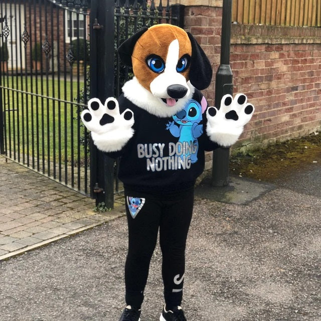 Kid wearing beagle fursuit standing at the street