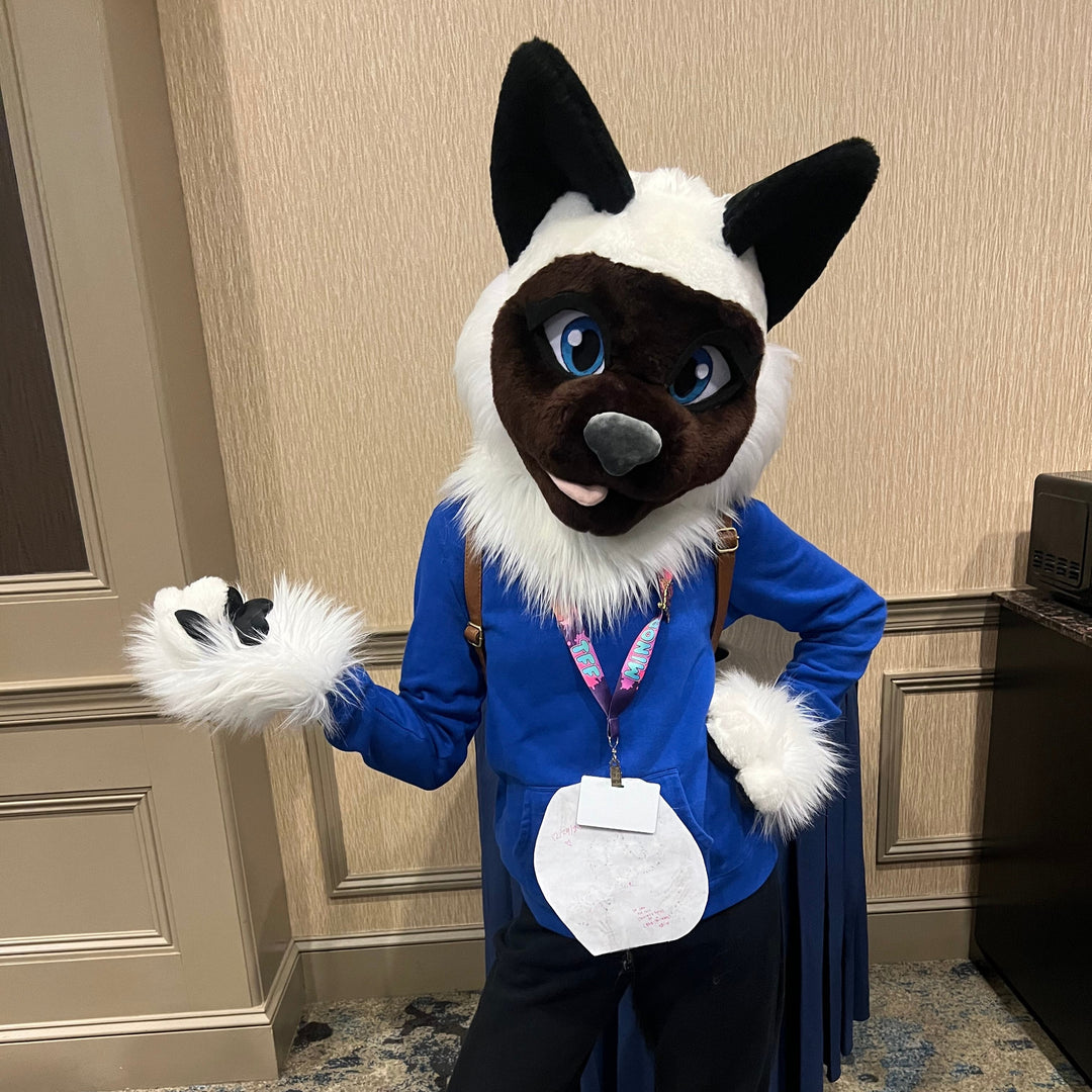 10-year-old girl wearing a cat fursuit at a convention