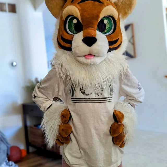 8-year-old kid posing in a ginger tiger fursuit