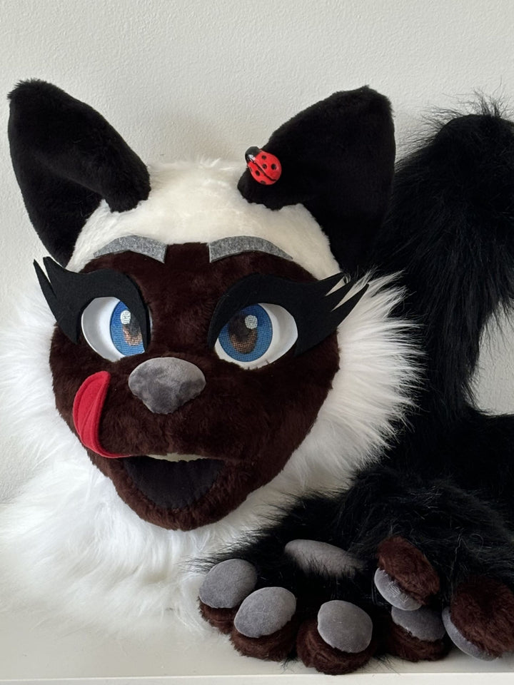 Posable tongue removable on velcro