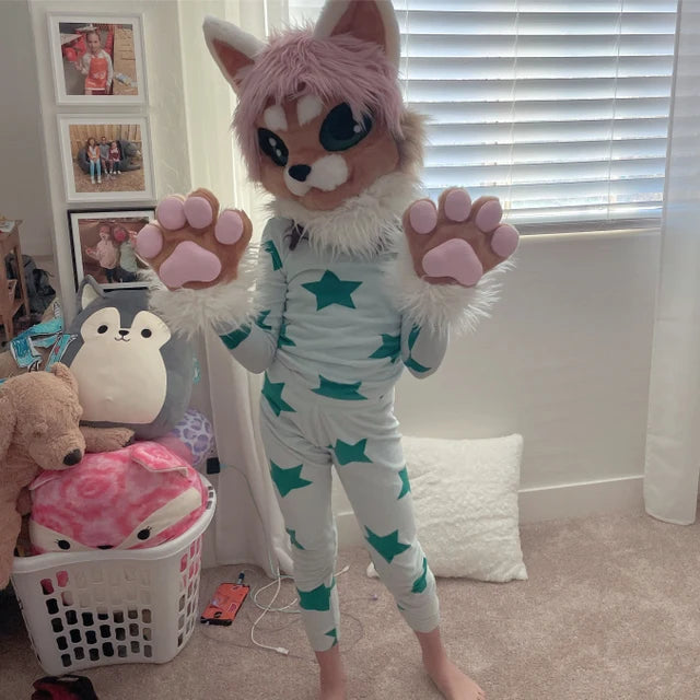 9 yeal ol girl in her room wearing beige cat fursuit head and hand paws