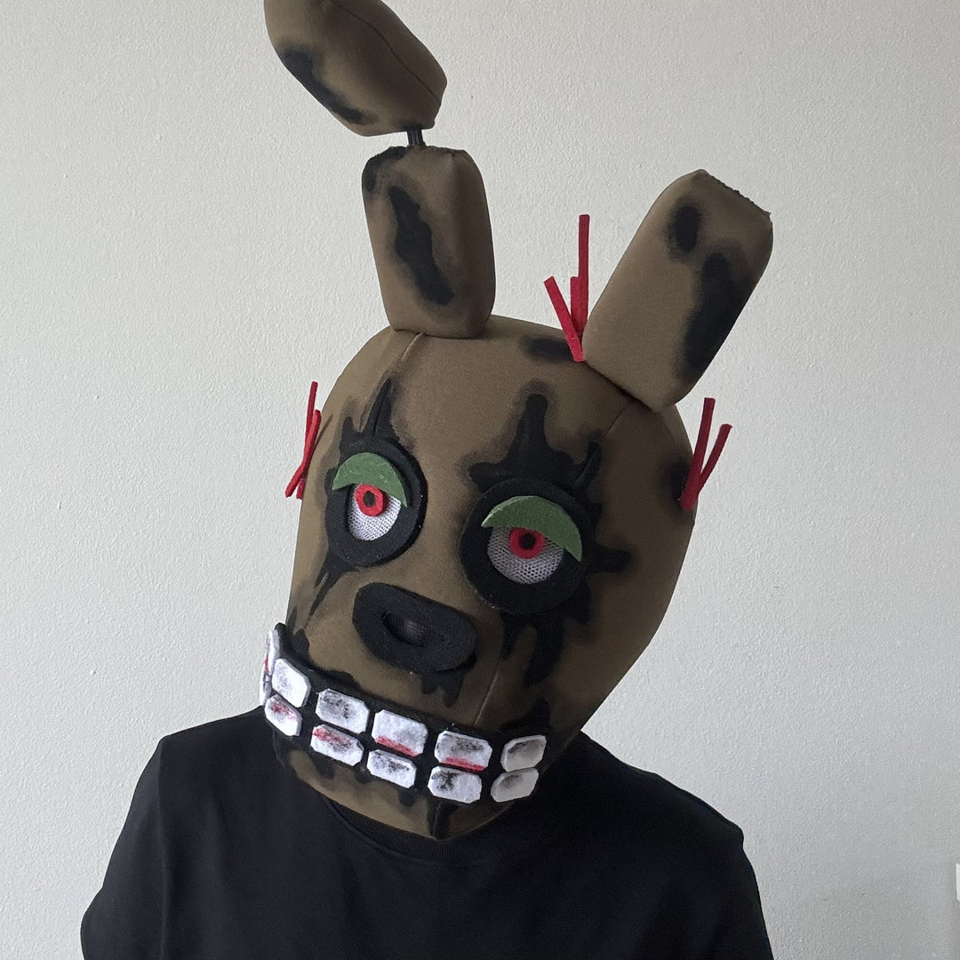 A person in khaki soft handmade animatronic spring bonnie mask