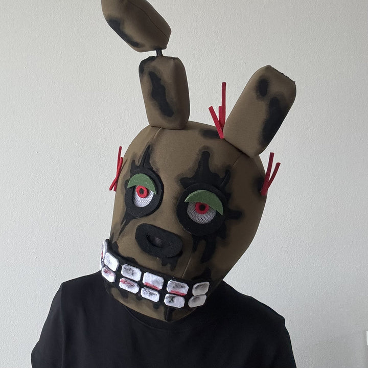 A person in khaki soft handmade animatronic spring bonnie mask